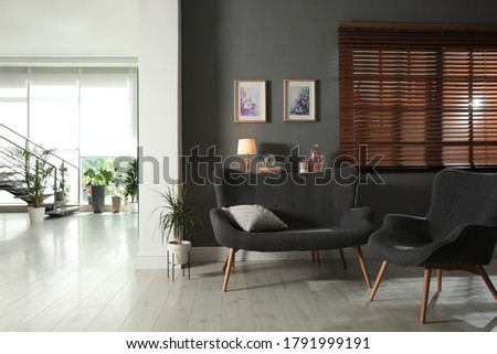 Stylish living room and hall in spacious house. Interior design Royalty-Free Stock Photo #1791999191