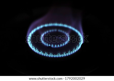 The  blue flame picture of the gas oven has a black  background 