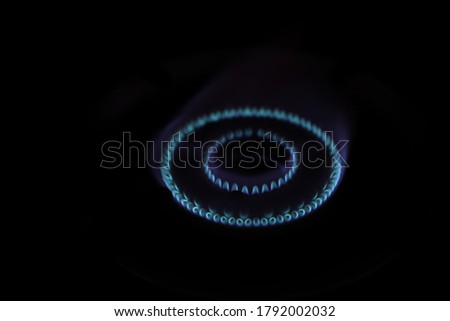 The  blue flame picture of the gas oven has a black  background 