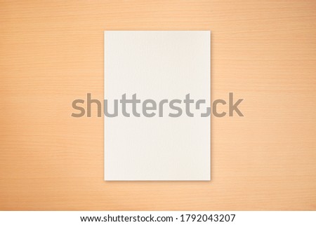Light wood texture with blank paper to use in design work Royalty-Free Stock Photo #1792043207