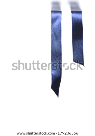 Blue silk ribbon falling over the edge