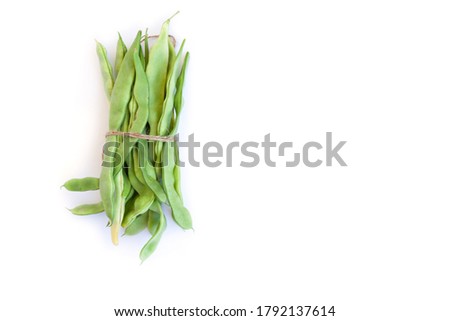 Beans in pod isolated on white. Common flat pod bean. Royalty-Free Stock Photo #1792137614