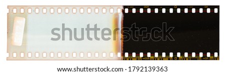 Start of 35mm negative filmstripe, first frame on white background, real scan of film material with cool scanning light interferences on the material.
 Royalty-Free Stock Photo #1792139363