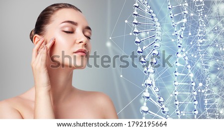 Young woman near digital DNA stems. Over blue background. Beauty science concept.