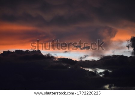 Sky dark orange and blue cloud black Royalty-Free Stock Photo #1792220225