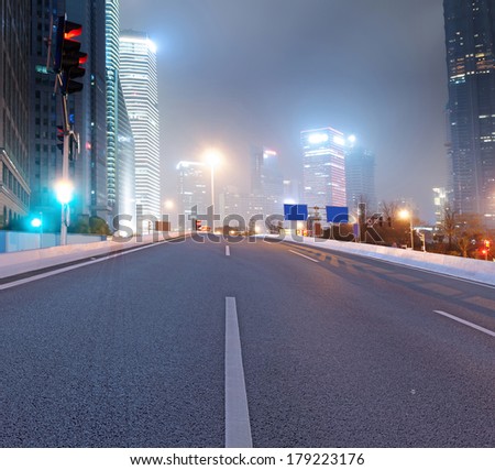 Asphalt road and modern city
