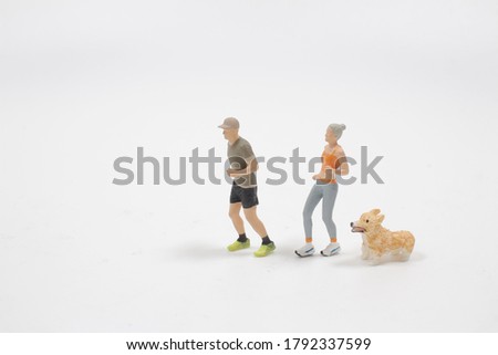 a mini people : Couple running on white background 