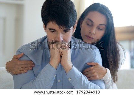 Head shot compassionate young woman giving psychological support help to thoughtful stressed beloved man in hard life situation, showing love care, overcoming grief together or apologizing indoors. Royalty-Free Stock Photo #1792344913