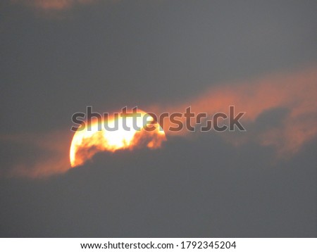 A beautiful sunrise sunshine in the cloudy weather sky backgorund cloudscape, yellow sun in the sunset in the urban areas. A outdoor and bright orange sunlight in sunrise