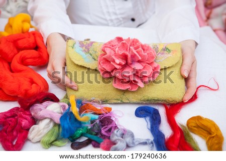 Felting activity - felted bag with pink peony Royalty-Free Stock Photo #179240636