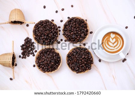 Top view cup of coffee and coffee latte on table background