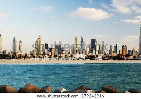 Downtown of Dubai (UAE, United Arab Emirates). The view from the Persian Gulf. A picture of the city of modern business, opportunity and progress. A symbol of globalization and modern human life. 