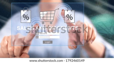 Woman touching a sales and discounts concept on a touch screen with her fingers