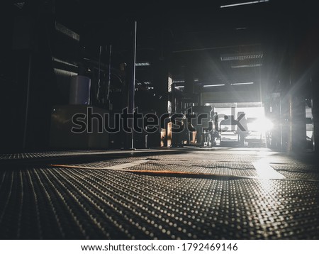 unfocused image of silhouette of the dark gym background with the sunlight  upon gym floor Royalty-Free Stock Photo #1792469146