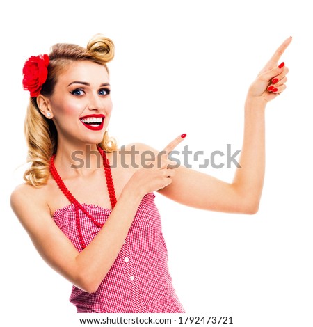 Amazed happy woman pointing at something. Excited girl in pin up, showing product or copy space for text. Retro fashion and vintage. Isolated over white background. Square. 