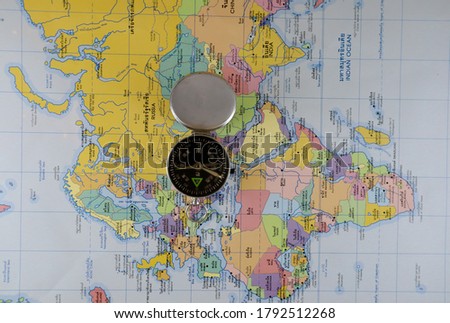Magnetic compass on the world map