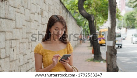 Woman use of cellphone in the street