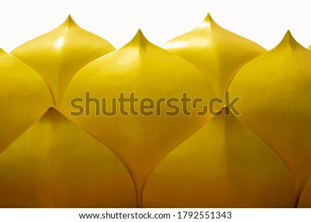 Golden yellow lotus flower stucco work on white background.