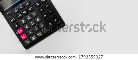 Calculator on the white background, business concept