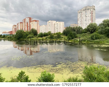 Moscow region, the city of Balashikha. Pekhorka river in summer and view of Zarechnaya street in cloudy morning