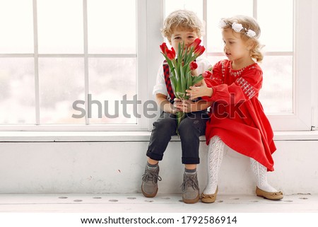 Children with flowers. Gentelman with tulip. Mother's day. Valentines day.