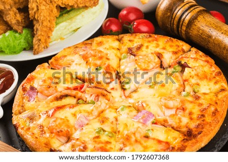 Tasty fresh pizza with seafood on table, 