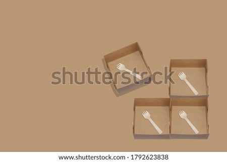 Design place a box focus at spoon fork wood small size put in paper box brown colored or snack box.Presenting the concept of environmental protection recyclable paper box 