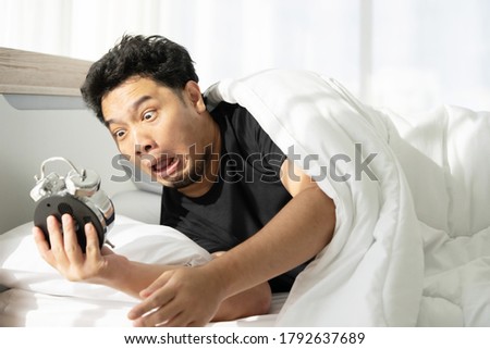 Asian Man with Shocked Face after Wake Up Late and Missed the Appointment Royalty-Free Stock Photo #1792637689