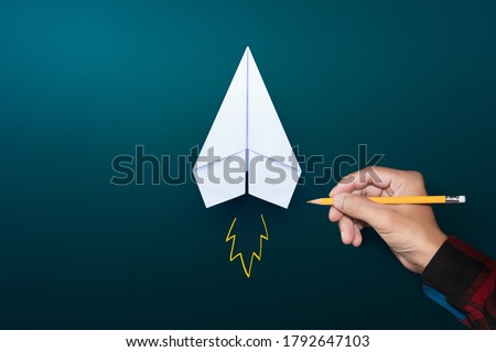 Startup concept, White paper plane and businessman hand drawn launching plane