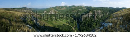 Muradymovskoe gorge. Beautiful large panorama of mountains with forest.
