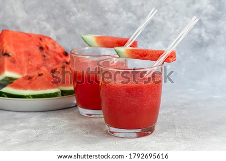 Watermelon pulp smoothie. Delicious red sliced watermelon on a plate. Stock of fiber and fructose. Summer food concept. Copy space.