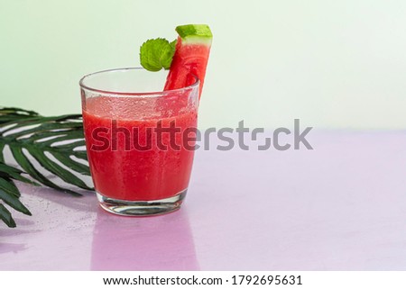 Watermelon pulp smoothie. Delicious red sliced watermelon on a plate. Stock of fiber and fructose. Summer food concept. Copy space.