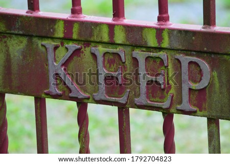 a metal sign reading keep