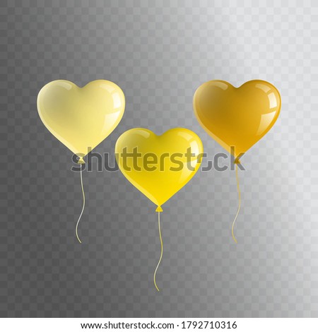 Realistic festive balloons in the shape of a heart light yellow, yellow and dark yellow. Isolated objects.