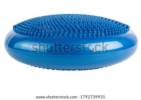 Blue inflatable balance disk isoleated on white background, It is also known as a stability disc, wobble disc, and balance cushion. Royalty-Free Stock Photo #1792739935