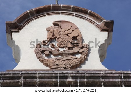 Mexican coat of arms carved in rock
