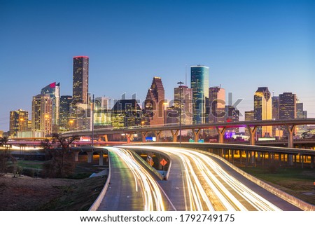 Houston, Texas, USA downtown skyline over the highways at dusk.