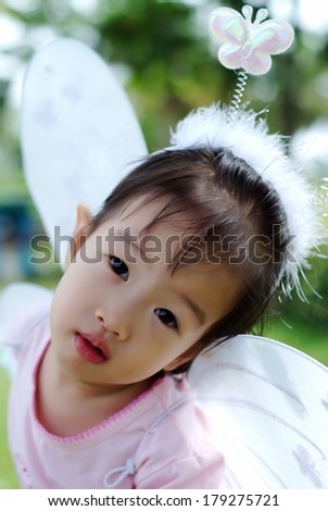 asian little girl in nature.