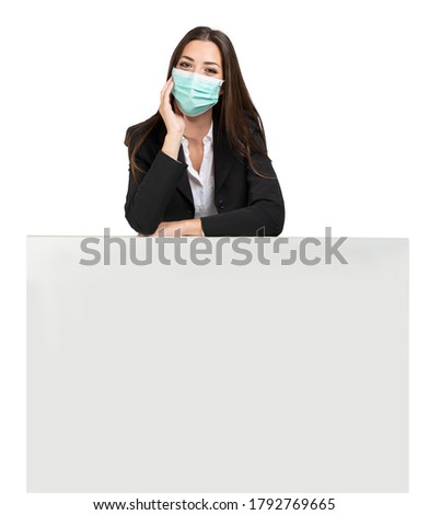 Masked woman leaning on a sign, advertisement during coronavirus pandemic, isolated on white