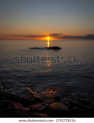 The sun sets on the South shore of Lake Superior.