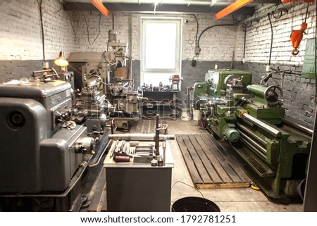 interior of a turning workshop, equipment for cutting and processing metal, production of metal parts