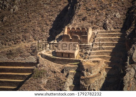 Landscape view of Ollantaytambo in Cusco, Peru. Inca ruins at the Sacred Valley, famous archeology destination for tourism, surrounded by hills and mountains.