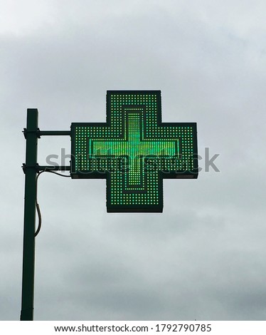 European green cross pharmacy store sign: Farmacia. Pharmacy sign.