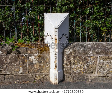 A traditional mile marker in the historic town of Shaftesbury in Dorset, UK. 