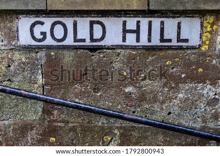The street sign for the famous Gold Hill in the town of Shaftesbury in Dorset, UK.  The hill was made famous by being in the iconic Hovis advert.