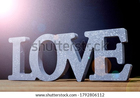 A studio photo of the word love