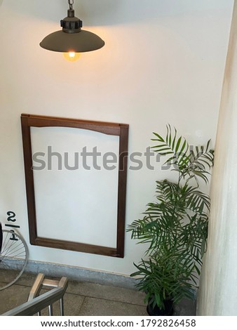Wooden picture frame on the wall