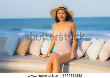Portrait beautiful young asian woman happy smile around sea ocean beach and blue sky for leisure travel vacation