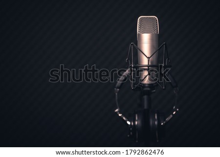 Sound and voice recording studio with nobody. Vintage style microphone and tools for record in room with noise reduction and resonance absorb foam wall in background for good acoustic with copy space.