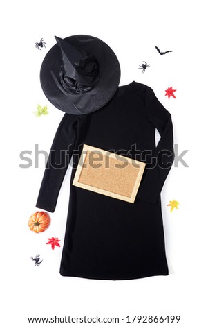 Top view black dress and wizard hat Fashion decoration for Halloween or Autumn background